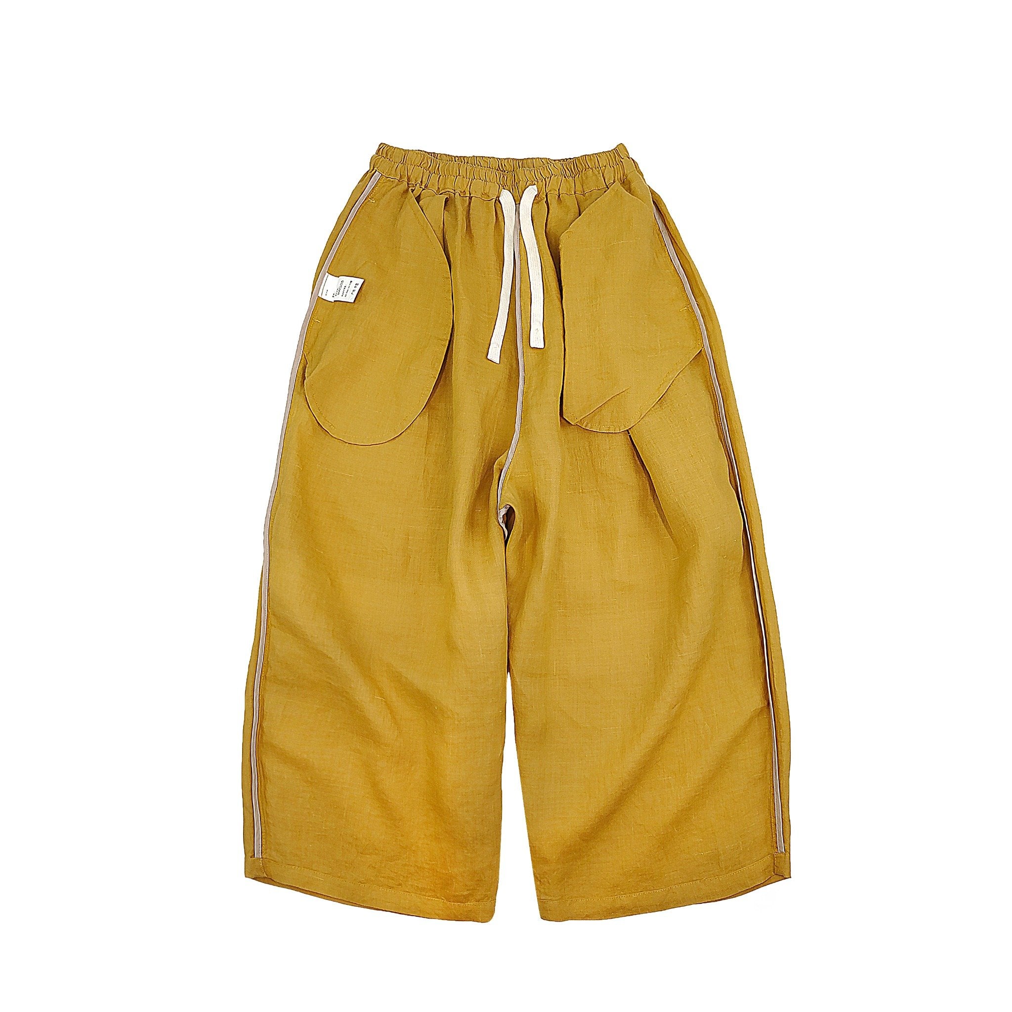Unique mustard yellow loose-fit pants for women, with oversized pockets and drawstring waist, cotton-linen blend